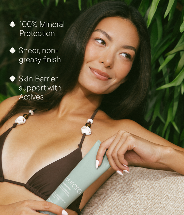 Model holding Eufora Aloetherapy Mineral Sunscreen with mineral protection and non-greasy finish benefits