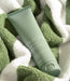 Eufora Aloetherapy SPF 30 Mineral Sunscreen tube resting on a green and white striped towel